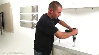 Gyford wire suspension surface mount installation showing the base plate, wire connection, and turnbuckle tensioning.