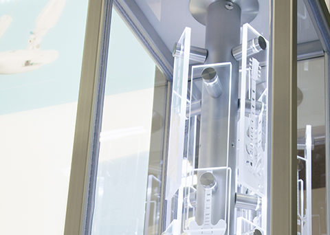 Decorative glass panels mounted with Gyford Hardware