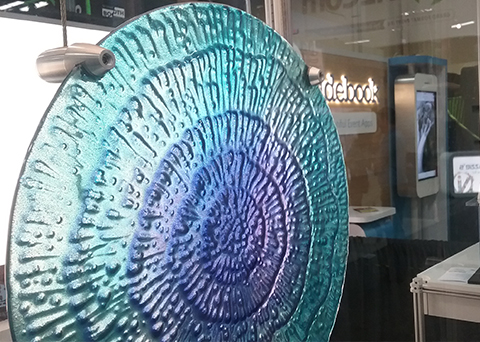 Gyford Surface mounted grippers on decorative glass piece