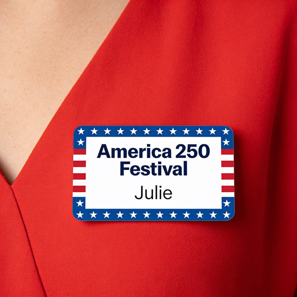 person in a red shirt wearing a name badge that says America 250 Festival Julie
