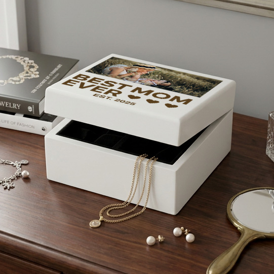 white engraved jewelry box that says best mom ever est 2025 with photo sitting on a dresser