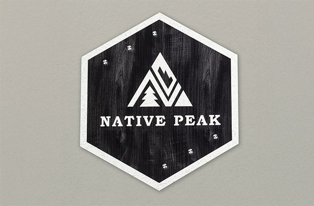 Rowmark The Naturals layered Native Peak Sign hanging on a wall