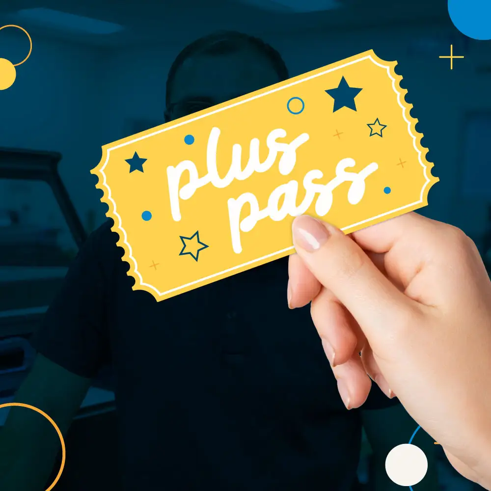 dark blue background with hand holding plus pass ticket